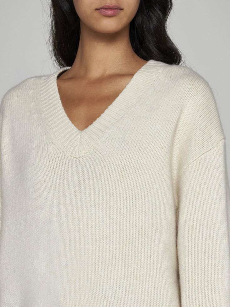 Totemes ivory wool and cashmere blend sweater featuring a V-neck, dropped shoulders and ribbed edges. Composition: 90% RWS wool 10% cashmere Cream V-neck Sweater For Work, White Cashmere V-neck Sweater For Fall, White Classic Cashmere V-neck Sweater, White Ribbed Cashmere Sweater, White Wool V-neck Sweater, Classic White Cashmere V-neck Sweater, Cream Cashmere V-neck Sweater For Winter, Casual White Cashmere V-neck Sweater, Elegant White Cashmere V-neck Sweater