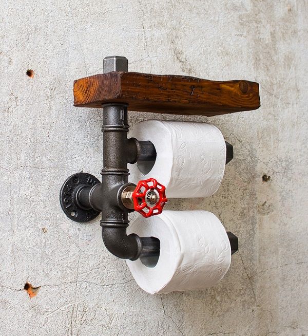 two rolls of toilet paper sitting on top of a faucet mounted to the side of a wall