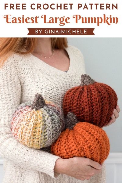 a woman holding three crocheted pumpkins with text overlay that reads, free crochet pattern fastest large pumpkin