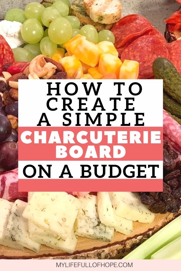 a plate with grapes, cucumbers and cheese on it that says how to create a simple charcuterie board on a budget