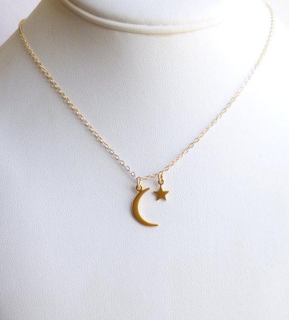 Made of high end gold Vermeil (gold plated sterling silver) and gold filled components, this necklace includes a petite moon and a tiny star.  The moon measures 21 x 8 mm and the tiny star only 12 x 6mm.  All hang from gold filled chain.  The charms are fixed through the links of the chain so they will lay separately instead of clustered.This necklace works beautifully as a mother's necklace with her star child or as a gift to wish someone luck in reaching their dreams.You may select any length 14k Gold Celestial Moon Charm Necklace, Dainty Moon-shaped Necklace With Star Charm, Dainty Crescent Yellow Gold Charm Necklaces, Dainty Yellow Gold Crescent Charm Necklaces, Yellow Gold Moon Necklaces With Star Charm, Celestial 14k Gold Charm Necklaces, Dainty Crescent Charm Necklace With Star, Gold Crescent Sterling Silver Charm Necklace, Celestial 14k Gold Charm Necklace