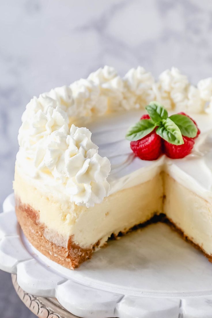 a cheesecake on a plate with a slice cut out