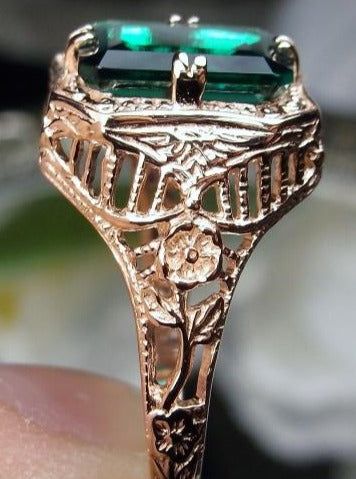 Natural Green Emerald 10k or 14k Rose Gold RingLovely Rectangle Design#D148 Make heads turn and stand out with this gorgeous piece of jewelry! This Edwardian reproduction filigree ring is made from rose gold and features an emerald cut high quality natural emerald gemstone measuring 9mm by 7mm. From the beautiful intricate floral daisy design to the inside of the band marked 10K or 14K for gold – this ring will take your look to the next level! Look no further than this exquisite vintage-inspire Luxury Rose Gold 14k Gold Emerald Ring, 14k Rose Gold Emerald Ring, Elegant 14k Rose Gold Jewelry With Emerald Cut, Elegant 14k Rose Gold Emerald Cut Jewelry, Luxury 14k Gold Emerald Ring Rectangular Shape, Luxury 14k Gold Rectangular Emerald Ring, Art Deco 14k Gold Emerald Ring, Luxury 14k Gold Emerald Ring With Rectangular Shape, 14k Rose Gold Emerald Cut Gold Ring