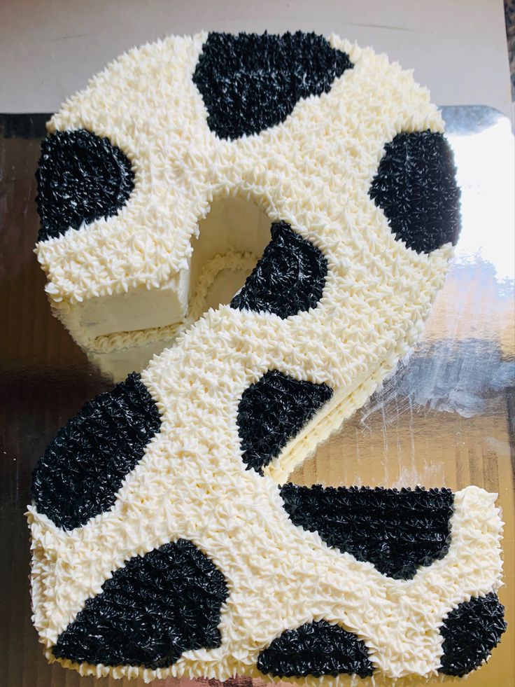 a cake with black and white designs on it