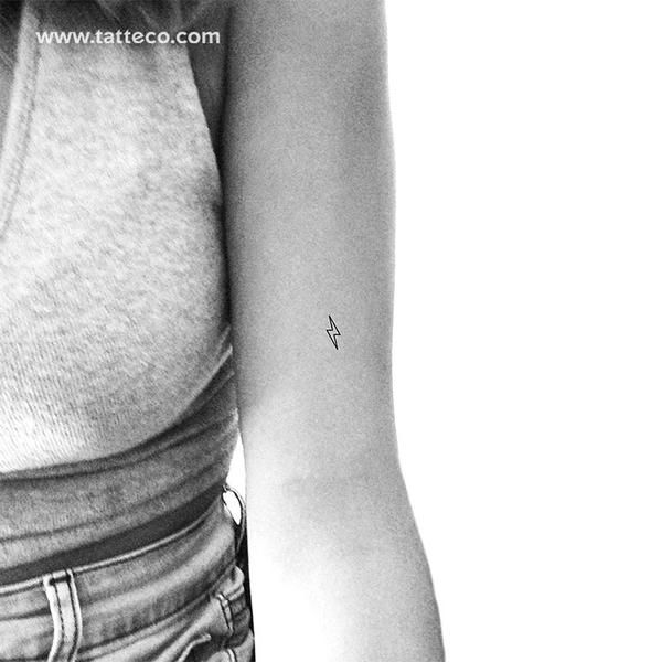 a woman with a small tattoo on her arm