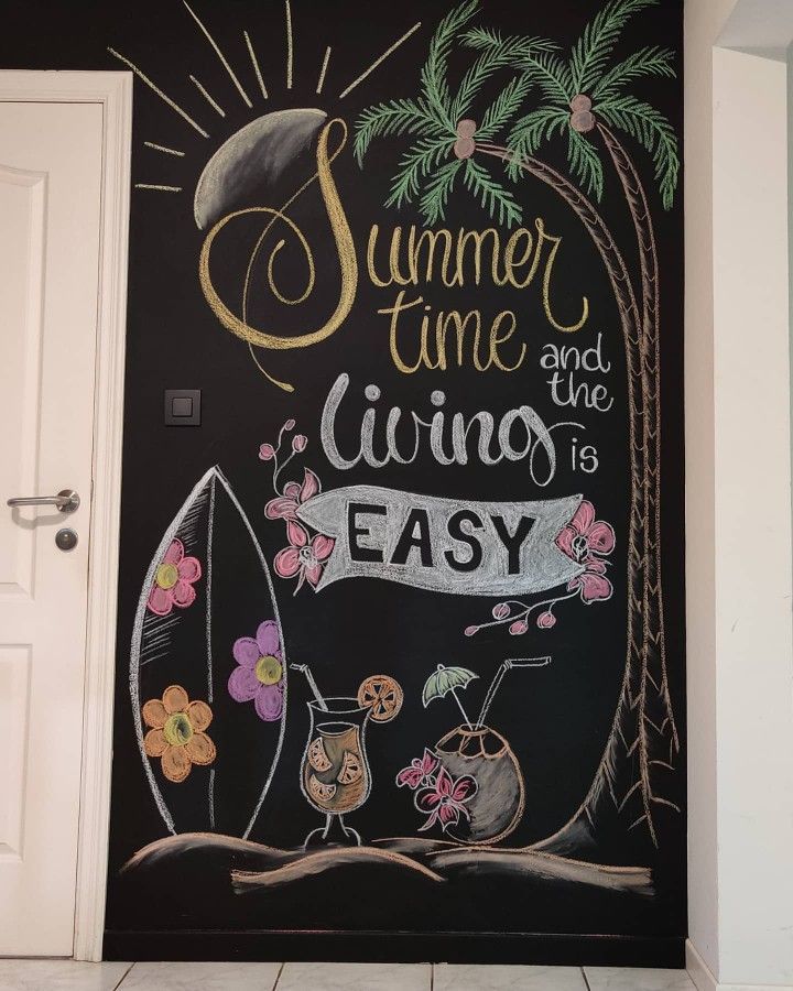 a chalkboard painted on the side of a door that says summer time and the living is easy