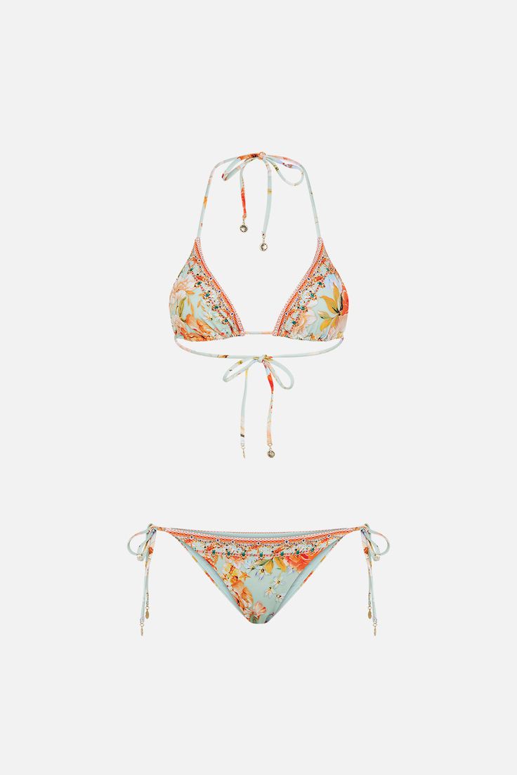 The Talk The Walk Tri Bikini With Trim is an immersion of fragrant blooms with subtle glimmers of hidden jewels and gilded flourishes dancing amongst a soft mint ambiance. Crafted from ECONYL® regenerated nylon, this sustainable bikini set plays host to hand-embellished CAMILLA crystals, thin string tie-up fastenings, luxe golden hardware and a cheeky cut. Lovingly crafted and designed in Australia, explore more from The Moral Of The Story: Act II collection. Designer Bathing Suits, The Moral Of The Story, Swimsuit Inspo, Moral Of The Story, Designer Bikinis, Soft Mint, Cute Bathing Suits, Karate Kid, Summer Bikinis