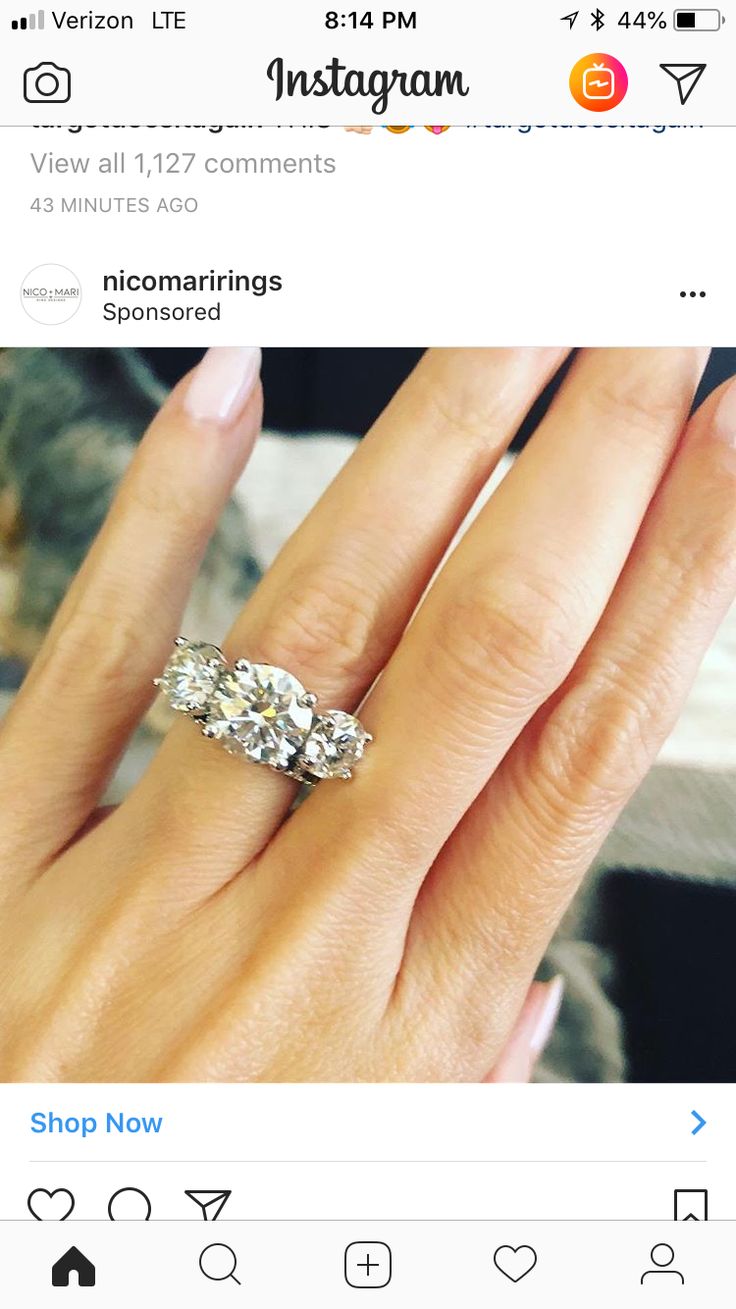 a woman's hand with an engagement ring on top of her finger and the words instagram above it