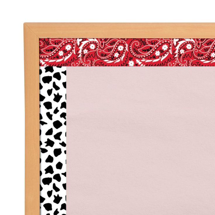 a wooden frame with an animal print border and pink paper in the center, on a white background