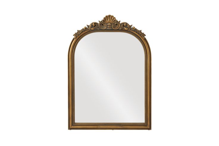 an ornate gold framed mirror on a white background