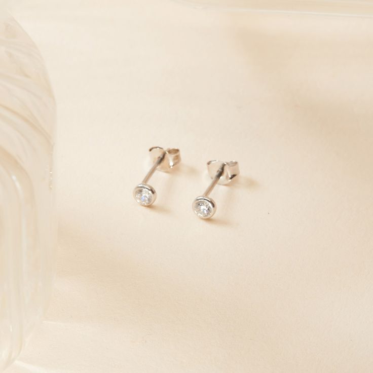 Classic and elegant, our Crystal Solitaire Stud Earrings are a timeless staple. A dazzling must-have for any jewellery lover who's ready to elevate their ear-stack. The possibilities are endless.&nbsp;18K Champagne Gold Plated or 925 Sterling SilverDiameter Zircon: 4mmSent with love in a complimentary gift box Minimalist Sterling Silver Earrings With Single Diamond, Sterling Silver Earrings With Single Diamond For Wedding, Silver Earrings With Single Diamond For Gift, Classic Silver Tarnish Resistant Diamond Earrings, Classic Silver Tarnish-resistant Diamond Earrings, Nickel-free Minimalist Cubic Zirconia Earrings, Minimalist Nickel-free Cubic Zirconia Earrings, Silver Drop Earrings With Single Diamond, Minimalist Single Diamond Drop Earrings