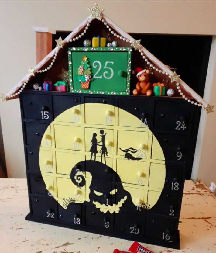 a clock made to look like a halloween house