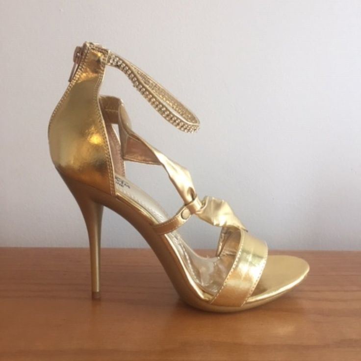 Product Description: The Metallic Hue And Studded Bow Embellishment Add Eye-Catching Style To These Sandals, And The Stillo-Heeled Sets Them Above The Rest. Man-Made Rubber Sole Platform Measures Approximately 1.00" Heel Measures Approximately 3.5 Inches" Platform Height: 1" (Approx) Imported True To Size Gold Open-toe Sandals For Prom, Gold Open Heel Sandals For Prom, Gold Open-heeled Sandals For Prom, Gold High Heel Sandals For Prom, Gold Sandals With 4-inch Heel And Closed Toe, Gold Open Heel Prom Heels, Gold Pointed Toe Sandals For Prom, Gold Sandals With 4-inch Heel For Prom, Gold Closed Toe Heels For Prom