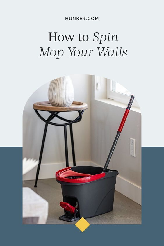 a bucket and mop on the floor with text overlay reading how to spin mop your walls