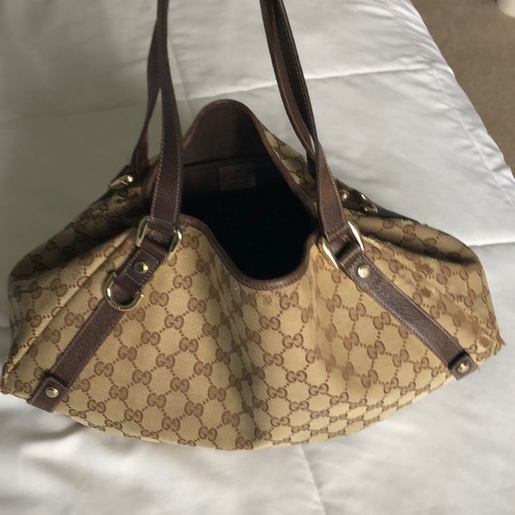 Beautiful Comfortable Authentic Used Gucci Hobo Bag. Used With Love. Gold Tone Hardware. See Pics For Wear Marks. Purchased At Neiman Marcus Boston. Designer Pre-owned Shoulder Bag, Luxury Pre-owned Brown Bag, Gucci Brown Shoulder Bag Satchel, Brown Gucci Bag For Everyday Use, Classic Pre-owned Shoulder Bag With Double Handle, Classic Pre-owned Bags With Double Handle, Gucci Beige Double Handle Bag, Gucci Brown Top Handle Shoulder Bag, Classic Brown Gucci Shoulder Bag