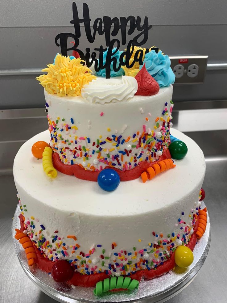 a birthday cake with sprinkles and decorations