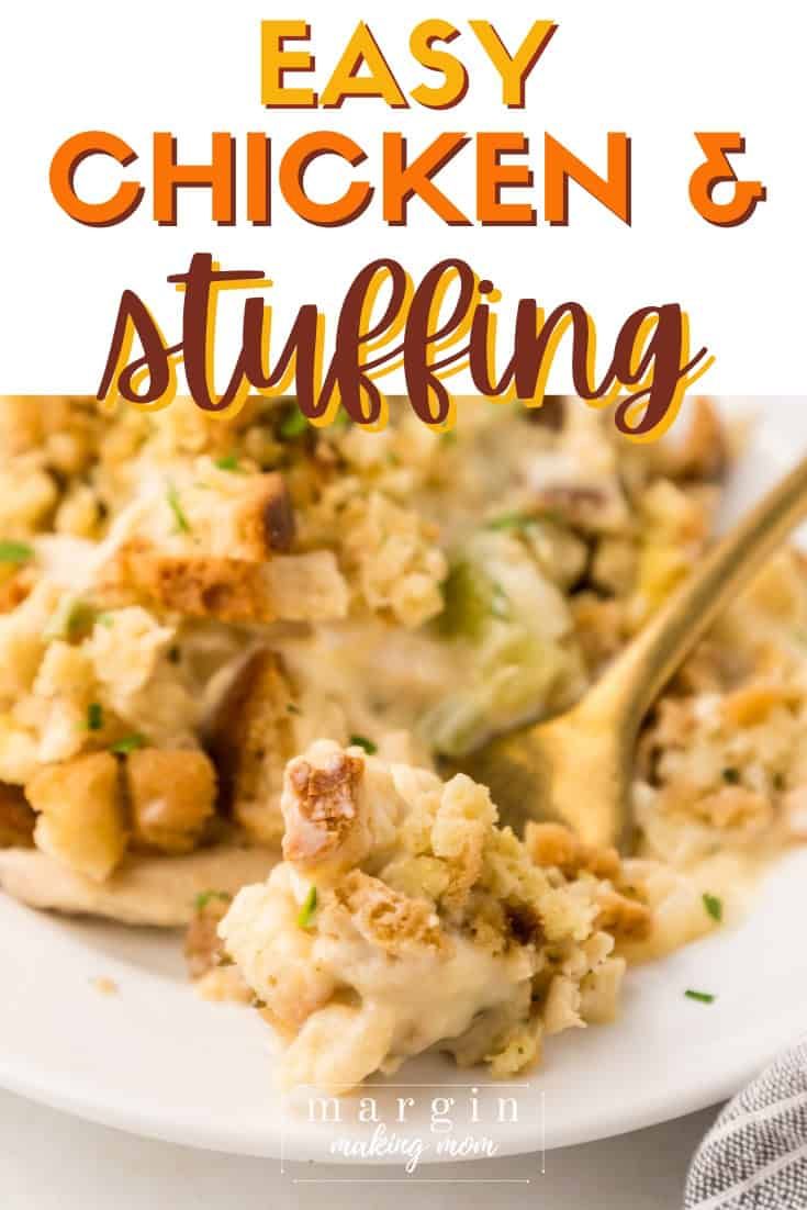 a close up of a plate of chicken and stuffing with a fork in the middle