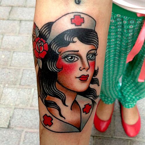 a woman with a nurse's hat tattoo on her leg