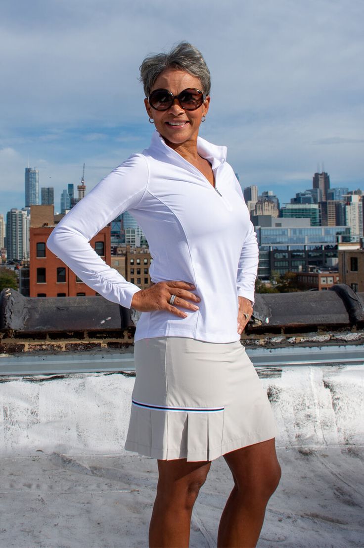 Our side-pleated technology allows for ultimate comfort while adding a cute flair while you're on the move. A timeless light khaki with a black and white grosgrain ribbon trim above the pleat is the perfect staple in your golf wardrobe. Honeymoon Attire, Golf Attire Women, Golf Attire, Golf Skort, Golf Outfits Women, Aging Gracefully, Ribbon Trim, Golf Outfit, Ladies Golf