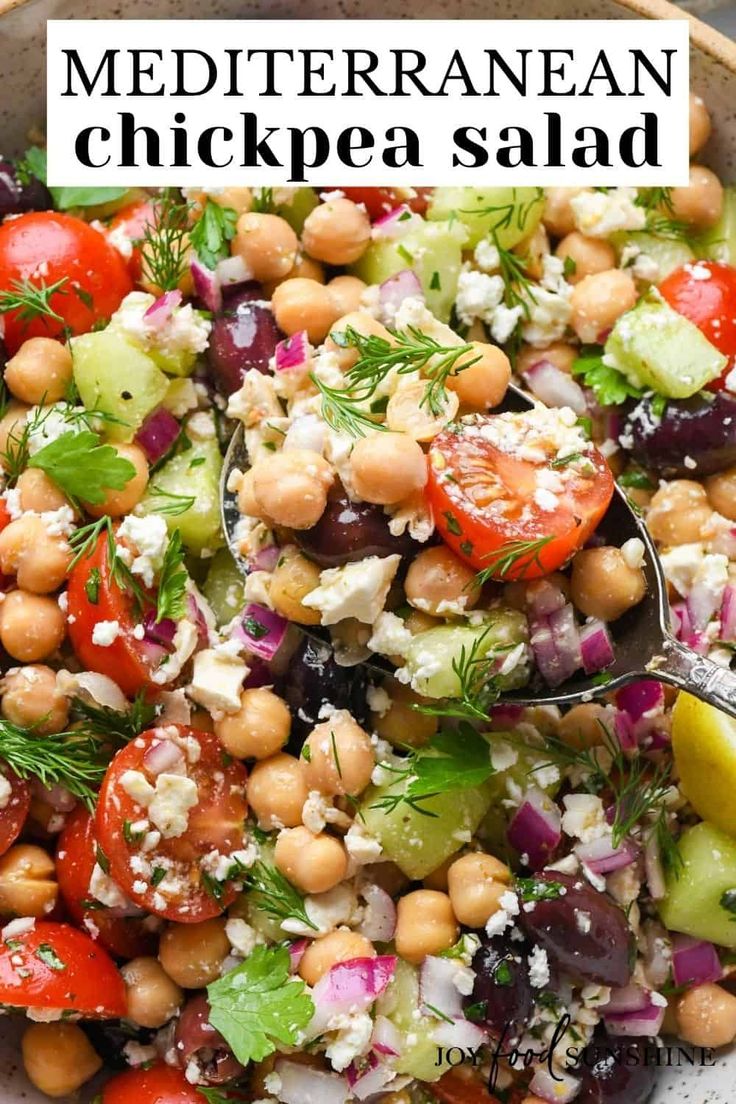 a bowl filled with chickpea salad and garnished with feta cheese