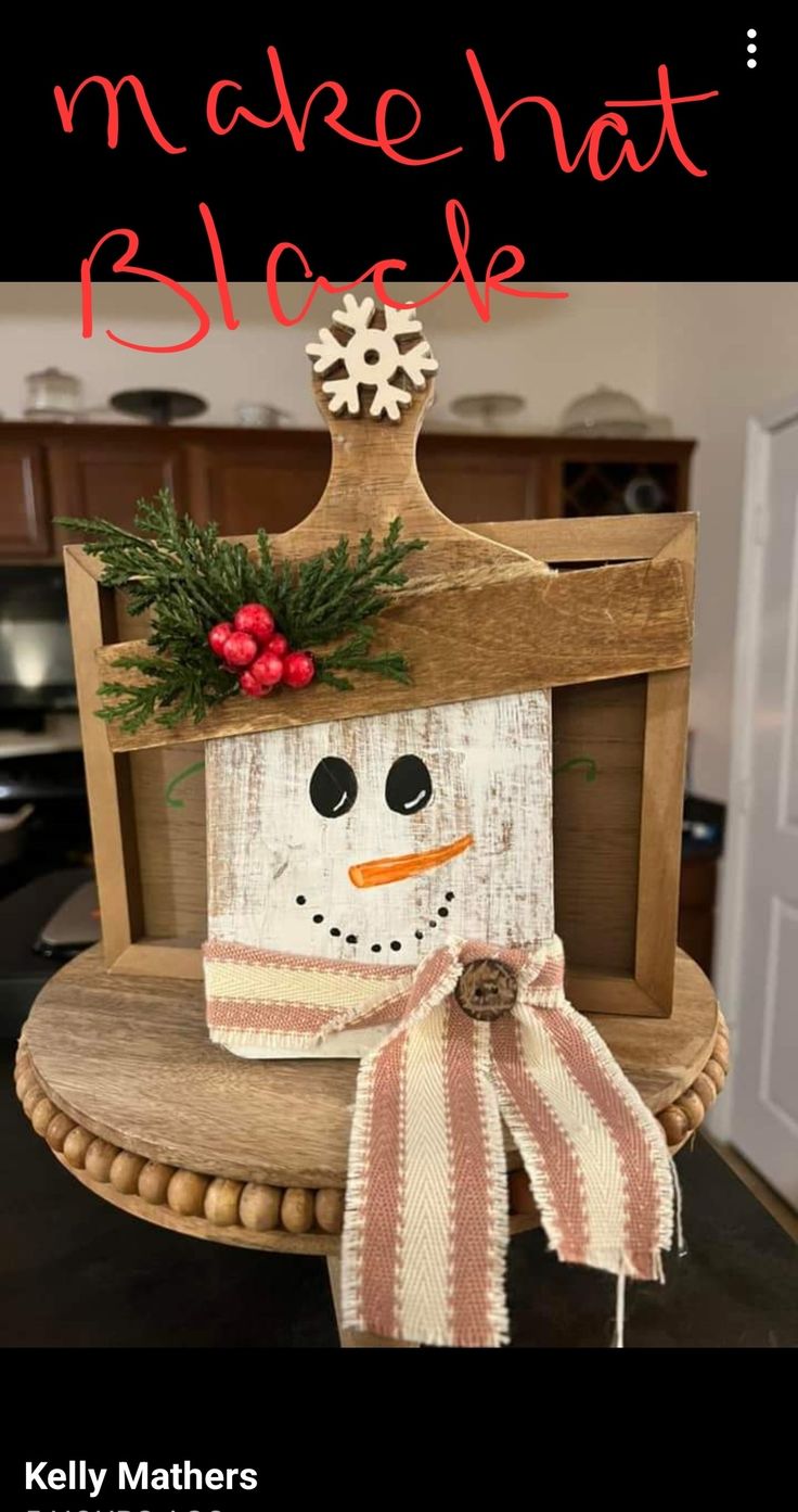 a wooden block with a snowman on it and the words made that sleighe above it