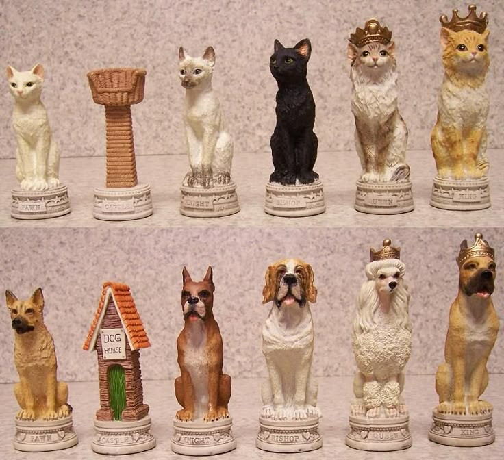 there are many figurines of dogs and cats