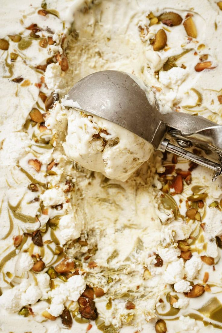 a scoop of ice cream with nuts and pistachio