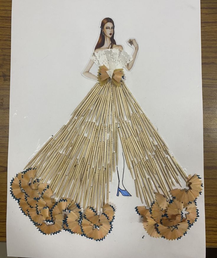 a drawing of a woman in a dress made out of sticks and flowers on a table