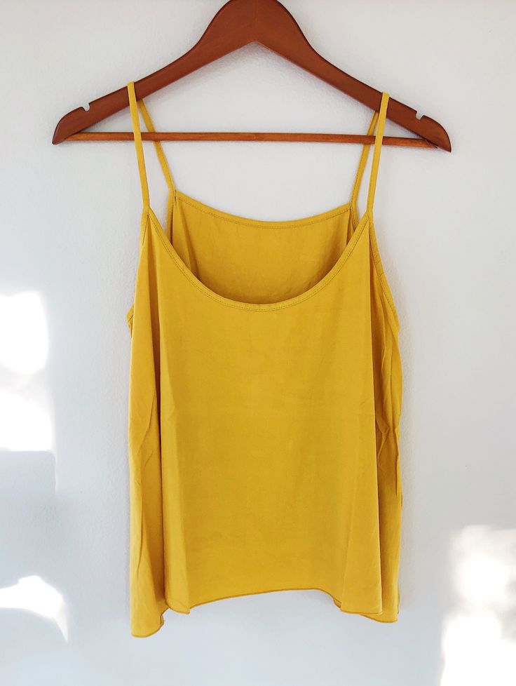 This amazing strap-y A-line tank is REVERSIBLE. Score! 1 tank, 2 ways to wear! Wear it tucked, as a layering piece, frontwards or 'reversed' for different looks. 100% Rayon Hand-wash cold Hang Dry Camisole With Built-in Bra For Day Out, Tank Top With Built-in Bra For Day Out, Summer Tops With Built-in Bra And Wide Straps, Sleeveless Tank Top With Built-in Bra For Brunch, Casual Tops With Wide Adjustable Straps, Summer Camisole With Adjustable Wide Straps, Yellow Tank Top With Built-in Bra For Spring, Solid Tank Top With Tank Straps For Day Out, Trendy Camisole With Tank Straps For Day Out