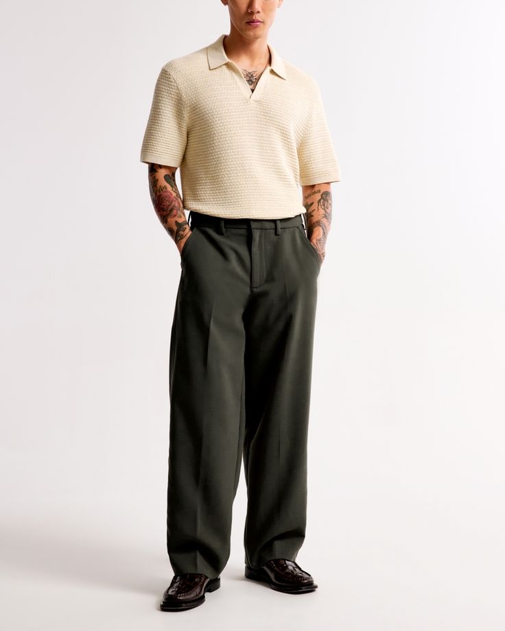 Our classic pant in a cleaned up silhouette and everyday menswear fabric. Fits wide through the leg and sits higher at the ankle. Features a shorter inseam designed to hit at the ankle and give a cleaner visual. For a standard visual, choose a longer inseam. Green Trousers Men Outfits, Court Outfit Men, Men’s Wedding Guest Attire, Green Trousers Outfit Men, Business Casual Black Men, Khaki Pants Outfit Men, Social Worker Outfits, Green Trousers Outfit, Chubby Men Fashion