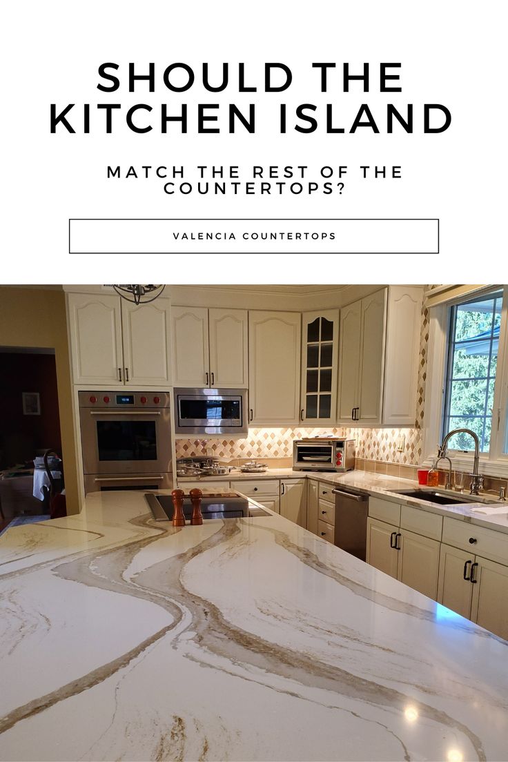 a kitchen island with marble counter tops and white cabinets in front of a window that reads, should the kitchen island match the rest of the countertops?