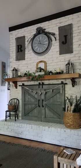 a living room filled with furniture and a clock on the wall above a fire place