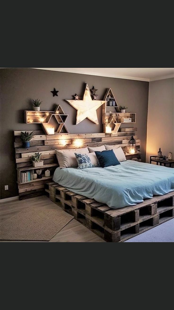 a bed made out of wooden pallets with lights on each side and stars above the headboard