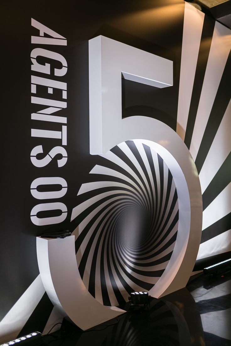 a black and white sign with the number five in it's center is shown