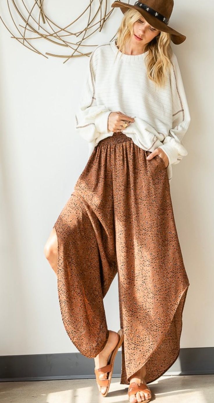 Description- -Leopard Printed Pants -Elastic Waistband -Scooped Leg Detail -Wide Leg Size Chart Small Medium Large Bust 34 36 38 Waist 26 28 30 High Hip 34 36 38 Low Hip 37 39 41 **in inches** We love an item that makes a statement. Our Billie Leopard pants do just that. These wide leg pants feature and elastic waistband and scooped bottom detail. This style fit true to size. Size Small fits 2-4// Medium fits 6-8// Large fits 10-14 @virginialane is wearing a size small White Tank Jeans, Moda Hippie, Animal Print Pants, Print Pant, Leopard Print Pants, Leopard Pants, Flowy Pants, Print Pants, Hippie Outfits