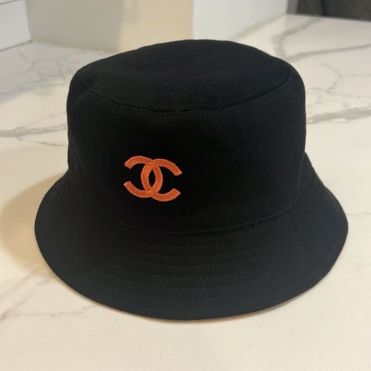 Purchased November 2023 In The Chanel Boutique. Extremely Rare And Impossible To Find In The Boutiques. Reversible. 2 Styles In One. Size Medium. Comes With Tag. Worn 1x On Vacation. Perfect Condition. Chanel Bucket Hat, Chanel Boutique, Chanel Accessories, On Vacation, Bucket Hat, Chanel, Women Accessories, Size Medium, Boutique