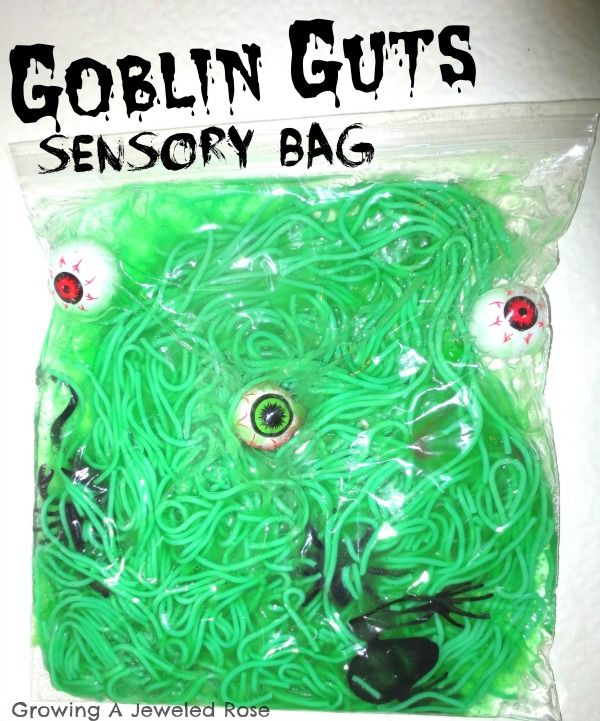 a bag filled with green rubber bands and eyes