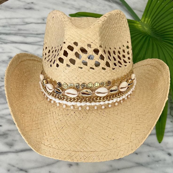 Jeweled Cowgirl hat handmade with love in Miami, FL. - Gold plated jewelry attached securely with adhesive - Hat available in tan or black  - Name can be added upon request - Hats are one size fits most Handmade Gold Wide Brim Hat, Handmade Gold Summer Hats, Bohemian Gold Hat With Short Brim, Elegant Gold Hat Band For Beach, Gold Festival Hat Bands For Summer, Gold Flat Brim Hat For The Beach, Bohemian Gold Straw Hat For Vacation, Gold Bohemian Brimmed Hat, Gold Flat Brim Sun Hat For Beach