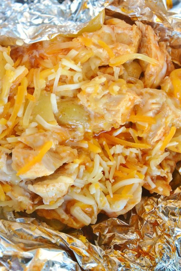 shredded cheese and meat in foil on top of each other