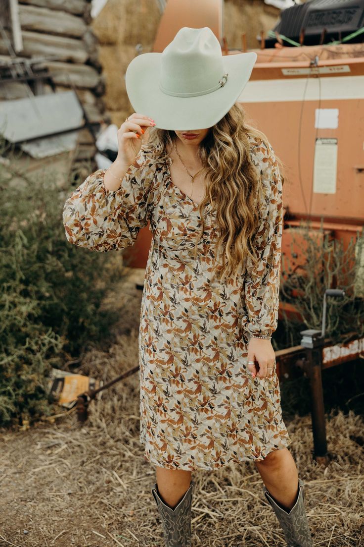 Introducing The Nellie Dress - the perfect fall dress with a midi length that flatters any figure. The charming falling leaf color print adds a touch of nature and the sweetheart neckline and elastic cuffs add a touch of elegance. This western dress is a must-have for your closet! Haylee is wearing size medium paired with Jukebox Boot and Felt Cowboy ProHat Falling Leaf, Autumn Leaf Color, Dress Men, Western Dress, Fall Dress, Leaf Coloring, Curvy Dress, Dress Gift, Western Dresses