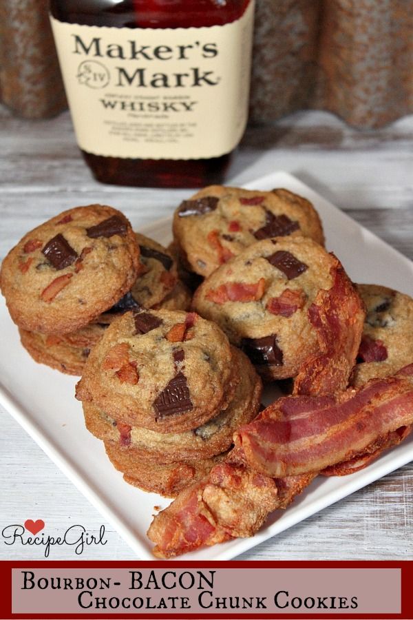 bacon and chocolate chip cookies on a white plate next to a bottle of maker's mark