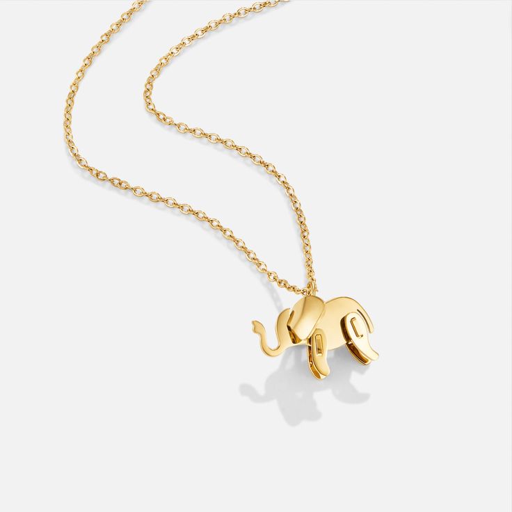 Elephants are one of the strongest and largest animals on our planet today. These beautiful creatures traditionally represent strength, power, and loyalty. Elephants are known for their clever natures and are often seen as good luck symbols throughout the world. Invite peace and clarity into your life when you wear this adorable necklace. Never forget the power you hold within yourself. Waterproof & tarnish-free Stainless steel, gold-plated Size: 15.7in (+ 2in adjustable) Size (pendant): 0.4in x 0.6in Lobster clasp closure Hypoallergenic, lead & nickel free If you aren't in LOVE with your purchase, please let us know within 30 days of receiving your item, and you'll receive a stress-free refund. Minimalist Good Luck Necklace With Round Pendant, Animal Design Jewelry Gift, Minimalist Good Luck Pendant Necklaces, Gold Necklace With Animal Design For Gift, Gold Animal Design Necklace For Gift, Elephant Design Gold Jewellery, Luck Symbols, Elephant Pendant Gold, Elephant Locket Gold