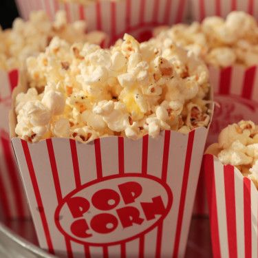 popcorn in red and white striped paper cups