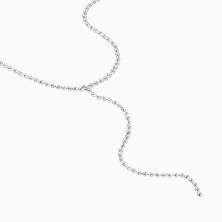 Add some length and texture to your necklace stack with our Ball Chain Lariat Necklace. Coming in gold and silver, this Y-shaped necklace is perfect for layering with all of your other chain necklaces. Love this look and want more long layering necklaces? Shop all of our lariat necklaces. Silver Chain Lariat Necklace, Minimalist Long Chain Lariat Necklace, Minimalist Long Lariat Necklace With Chain, Minimalist Delicate Lariat Body Chain, Minimalist Adjustable Lariat Body Chain, Minimalist Lariat Necklace With Satellite Chain, Silver Lariat Layered Necklace, Dainty Silver Chain Lariat Necklace, Trendy Silver Chain Lariat Necklace