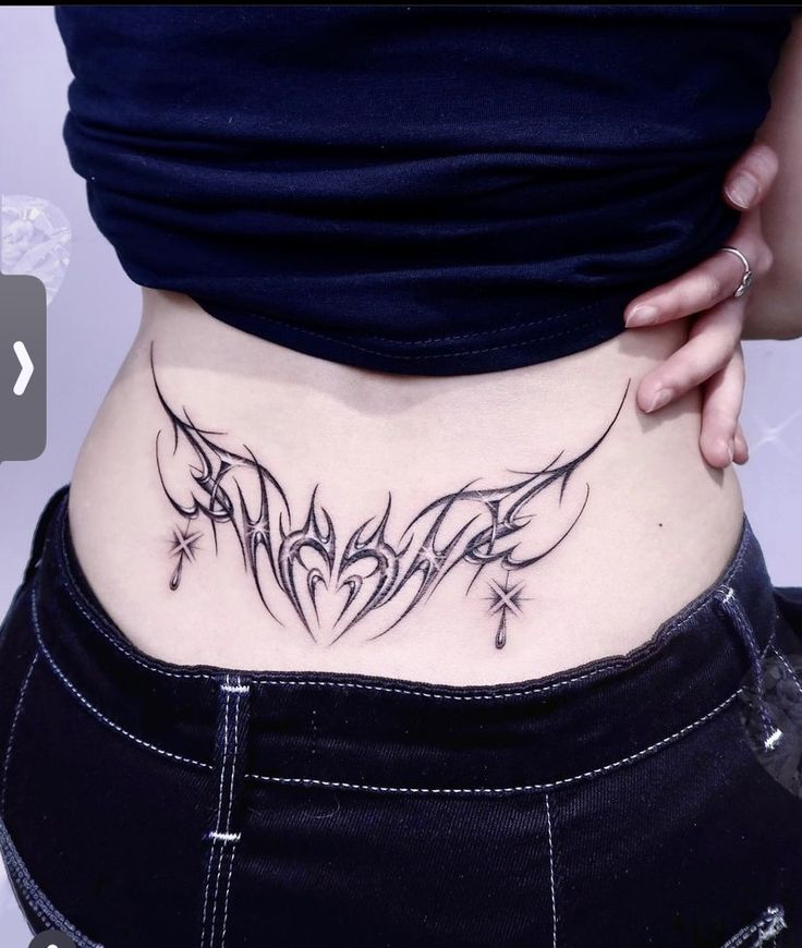 a woman with a tattoo on her stomach