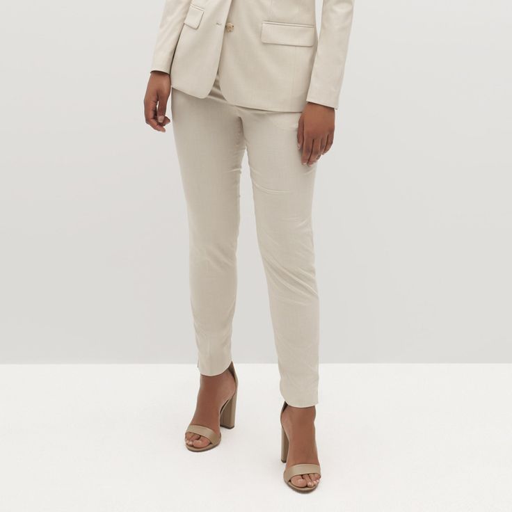 Keep it cool in the Women’s Tan Suit Pants. With a tailored design and comfortable drape, our light beige dress pants play up a classic look. A textured weave and coordinating marbled buttons elevate the look to lean into the luxurious, making these tan slacks women’s perfectly relaxed yet polished choice for events, weddings, and the everyday. Perennially on-trend, these delicate tan dress pants are women’s most cool and comfortable style update. Constructed with Eco Stretch fabric, the women’s Classic Linen Pantsuit For Formal Occasions, Classic Beige Pantsuit For Office, Versatile Formal Dress Pants For Spring, Elegant Linen Pantsuit For Formal Events, Elegant Linen Pantsuit For Formal Occasions, Classic Beige Office Pantsuit, Semi-formal Beige Trousers, Beige Formal Pantsuit With Straight Pants, Formal Beige Pantsuit With Straight Pants