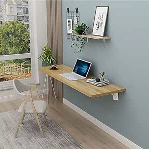 a laptop computer sitting on top of a wooden desk in front of a large window