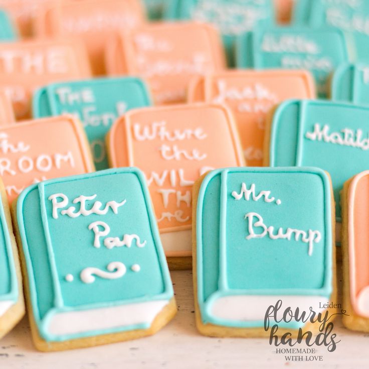 some cookies that are on top of a white table and one has writing on it