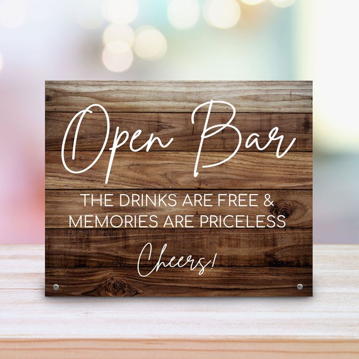 a wooden sign that says open bar the drinks are free and memories are priceless cheeses