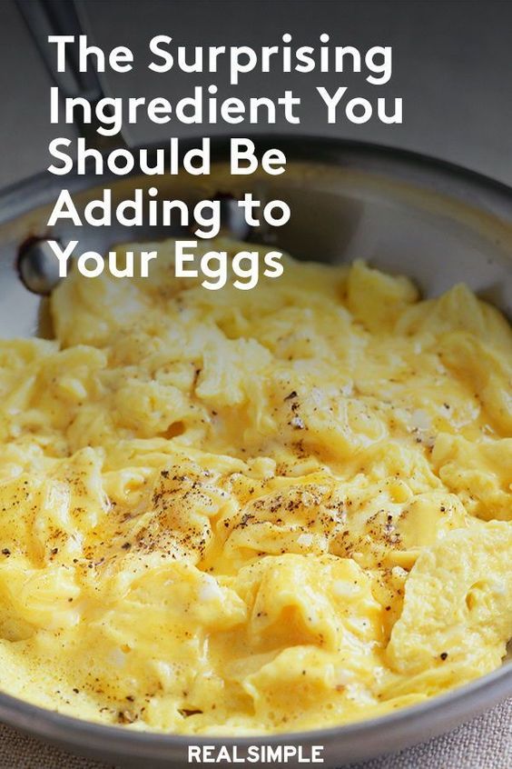 scrambled eggs in a bowl with the words, the surprising ingredient you should be adding to your eggs